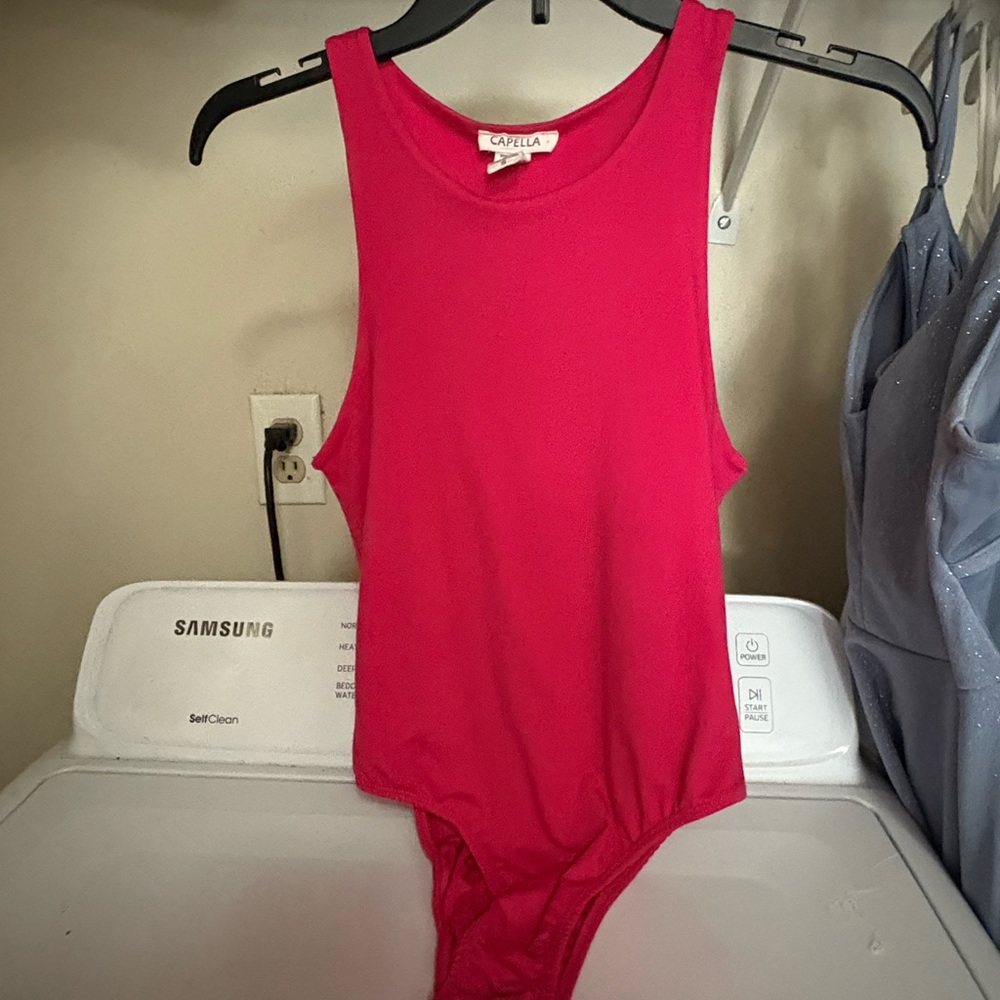 Hot pink body suit never worn. Size Woman’s small